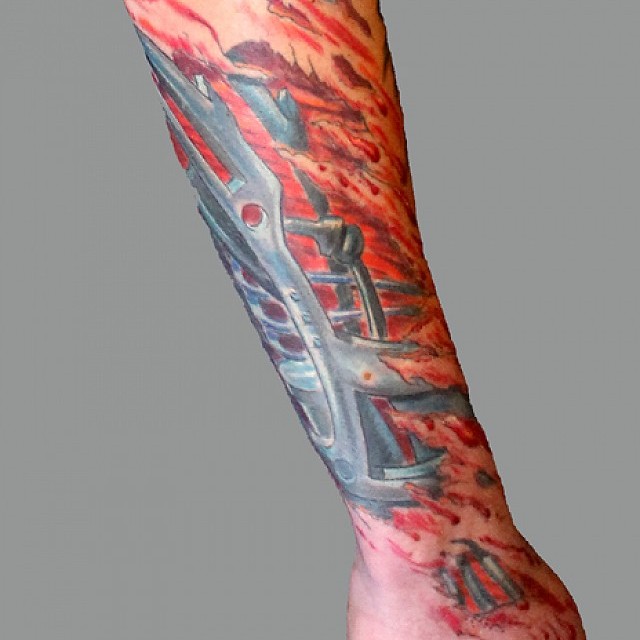 Biomech tattoo lower arm